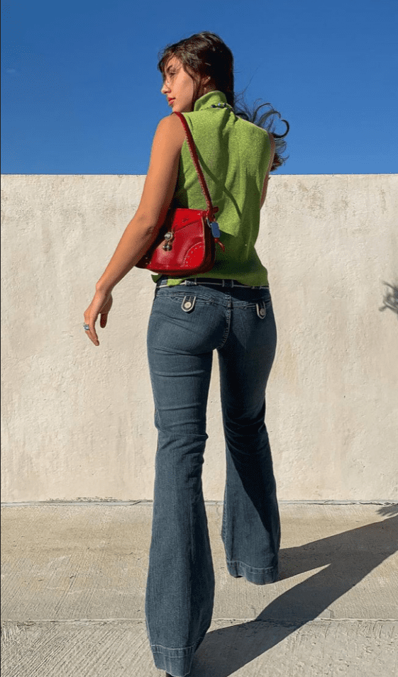 A woman wearing a sage green top