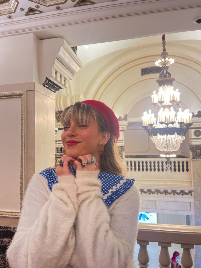 Lexy Silverstein poses for a photo in a museum