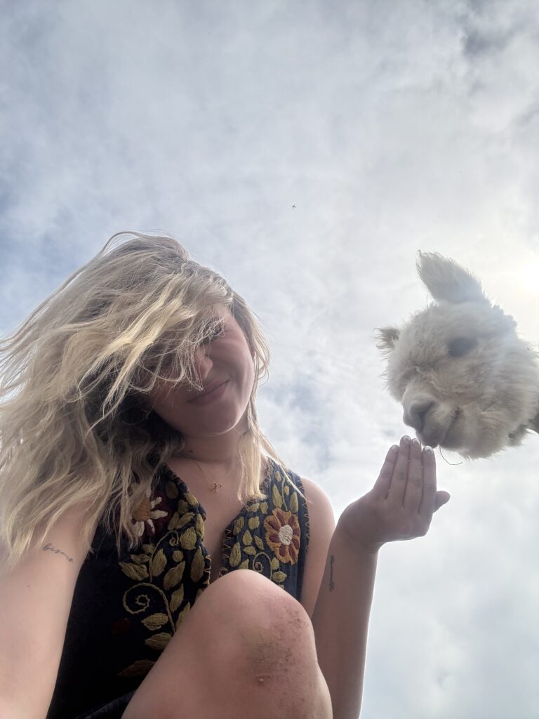 Lexy Silverstein with an alpaca